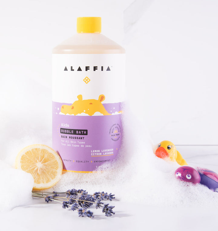 fair trade lemon lavender bubble bath pictured with lemon, lavender, bath toys, and bath bubbles